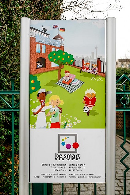 Sign with be smart illustrations at the entrance gate of Villa Heimat